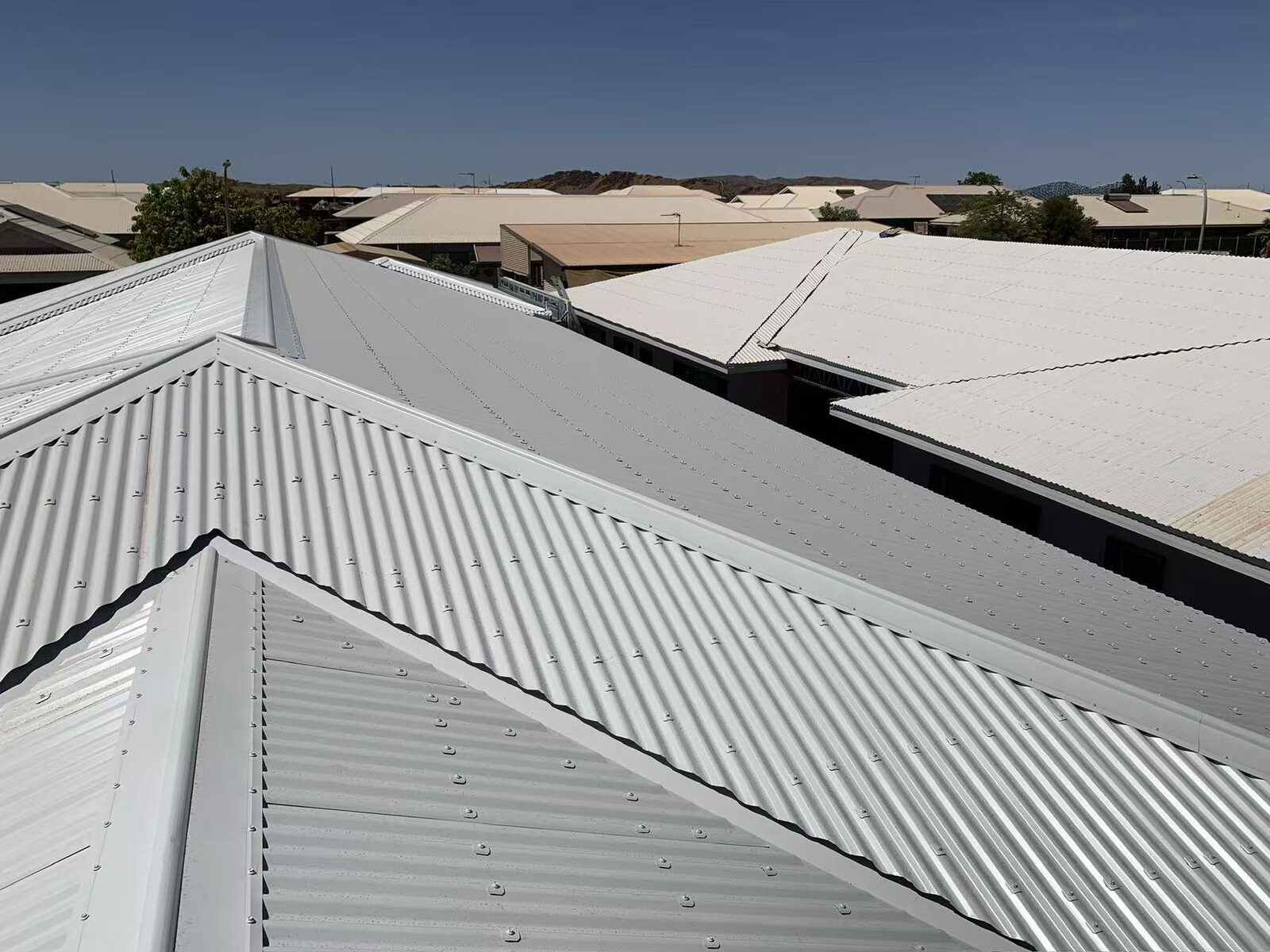 Streetscape of new Colorbond roofs in Karratha